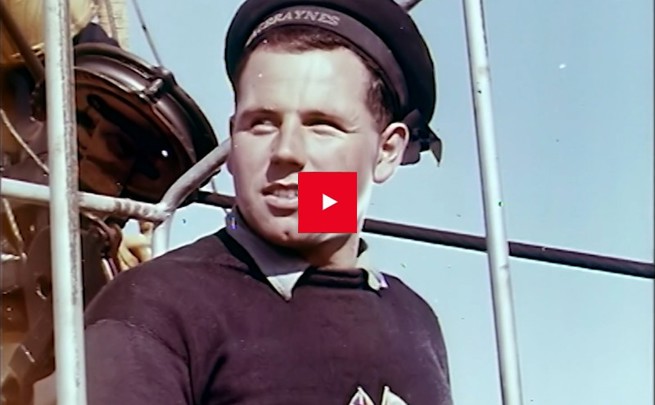 Vintage close up portrait image of a male MacBrayne's crew member with vintage uniform
