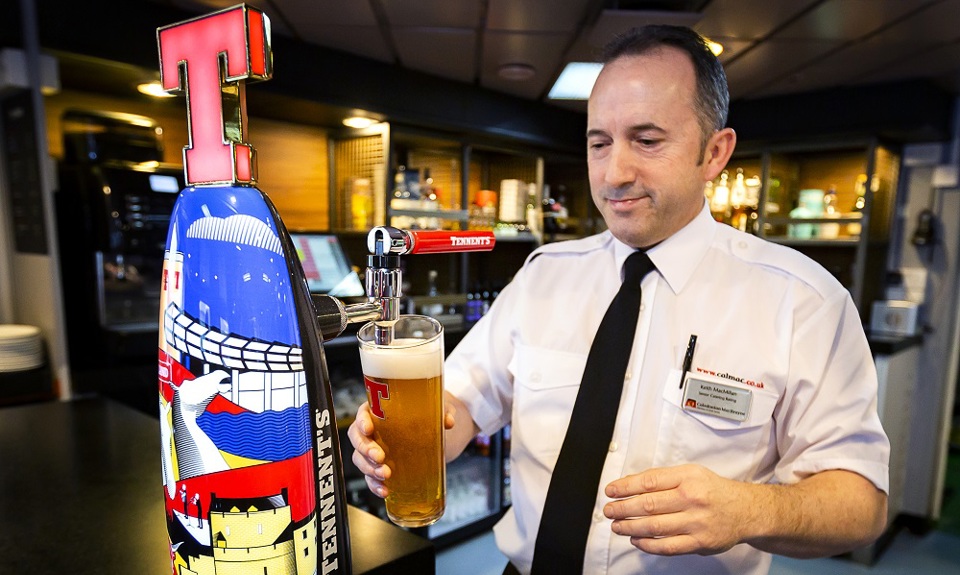 Ferry staff pouring a pint of beer