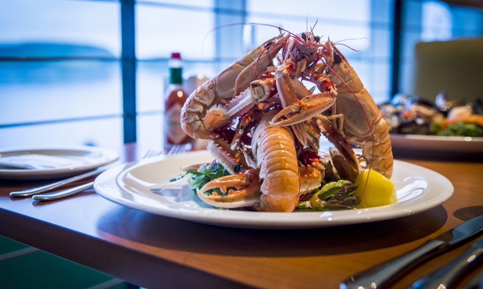 Shrimps on a plate in the restaurant piled high