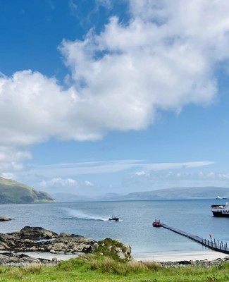 A CalMac ferry sitting berthed at the slipway, Kildonan on Morvern and Ardnamurchan